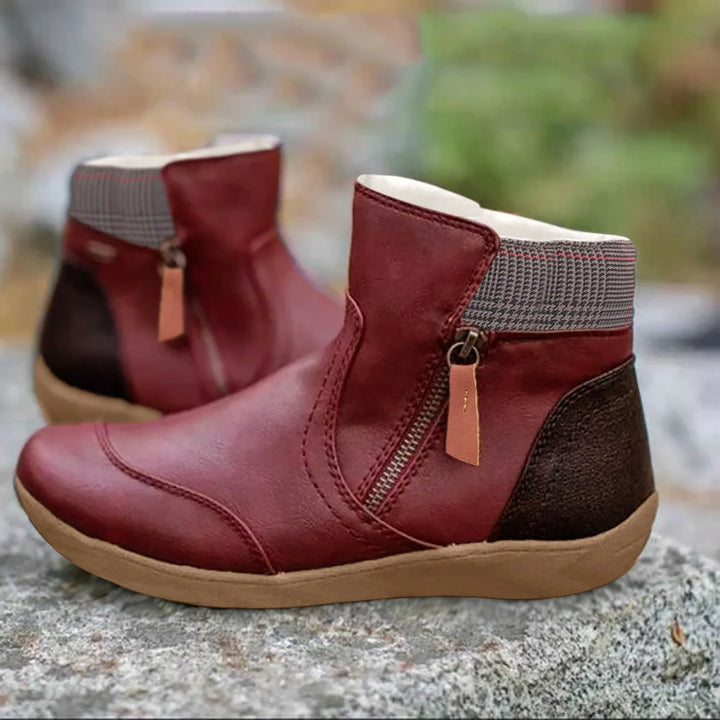 Women's waterproof leather ankle boots with ribbed collar detail and beige outsole