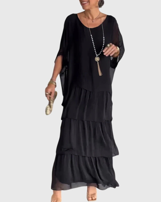 Close-up of lightweight fabric drape and tiered layers on bohemian maxi dress