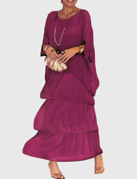 Full silhouette of relaxed-fit layered maxi dress with green top and multicolour skirt
