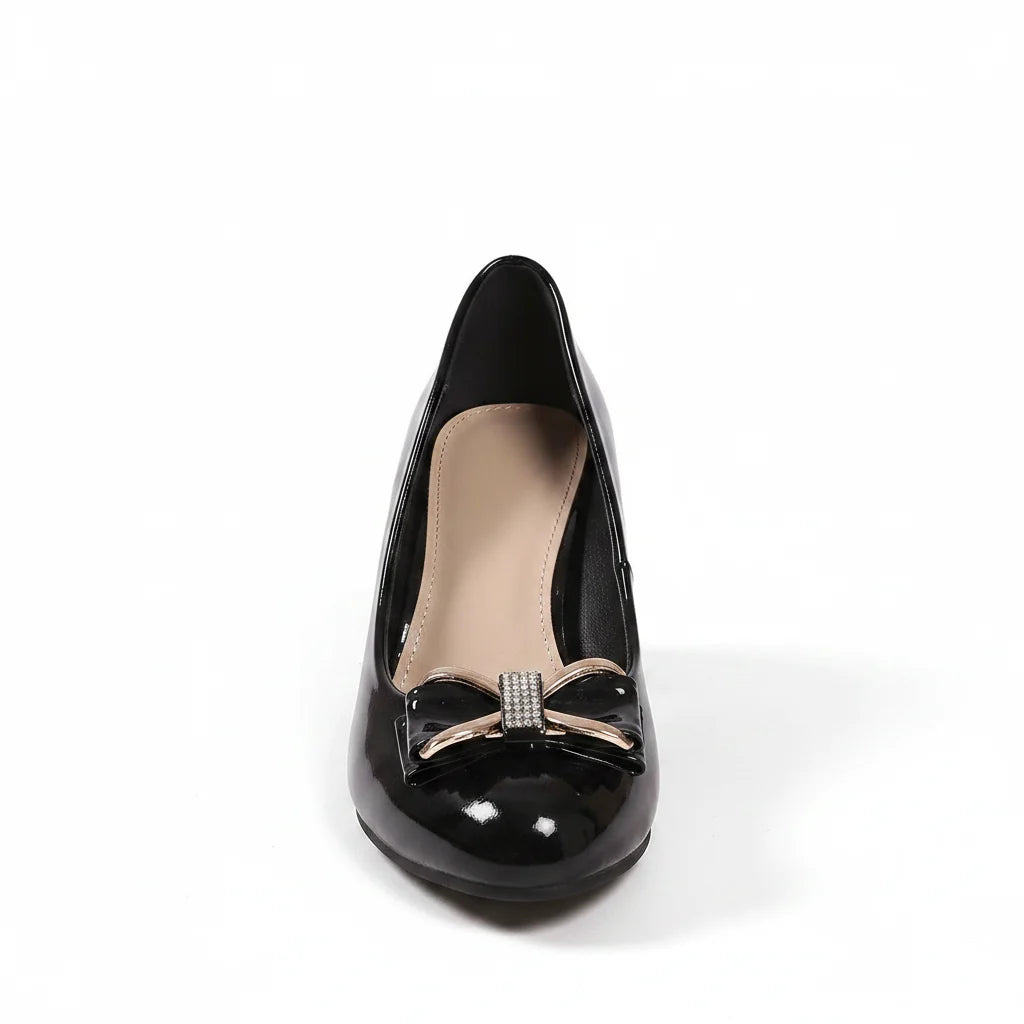 Close-up of bow accent detail on Bow Detail Block Heel Pumps with polished hardware embellishment