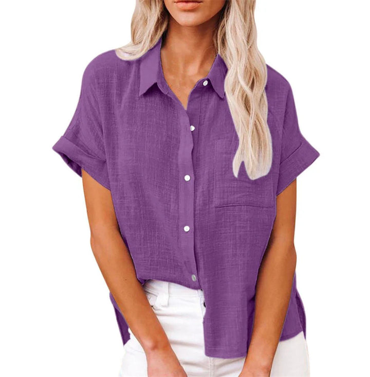 Flat lay of women's lightweight button-front shirt in pink showing full silhouette