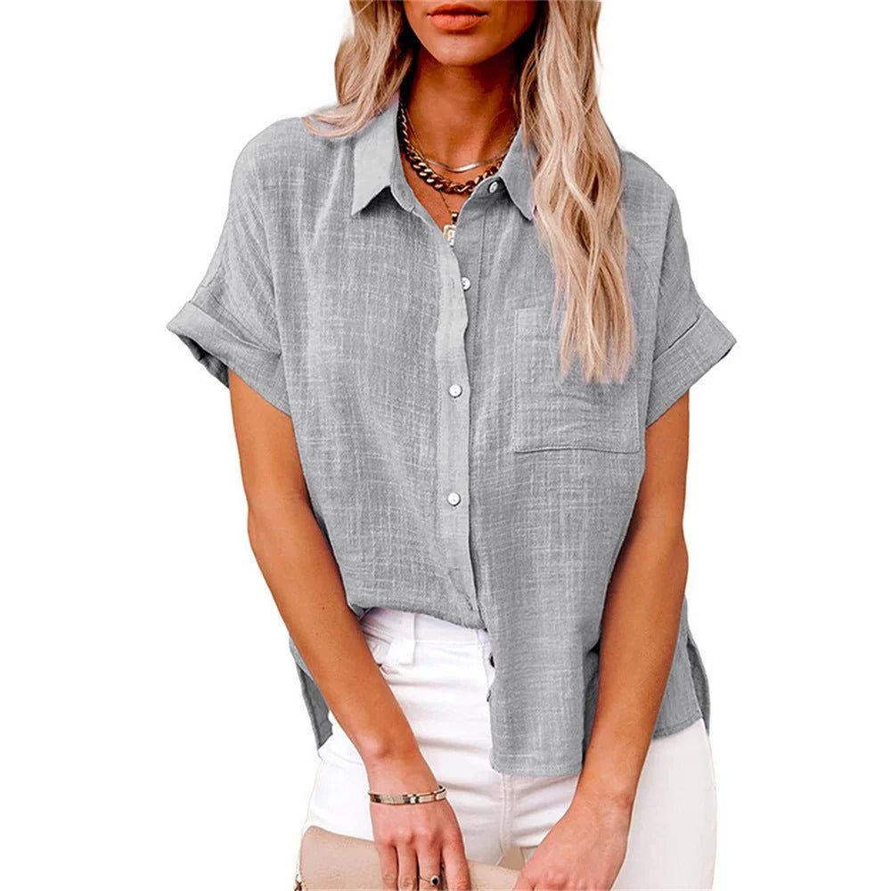 Woman wearing button-front shirt unbuttoned over camisole for layered styling