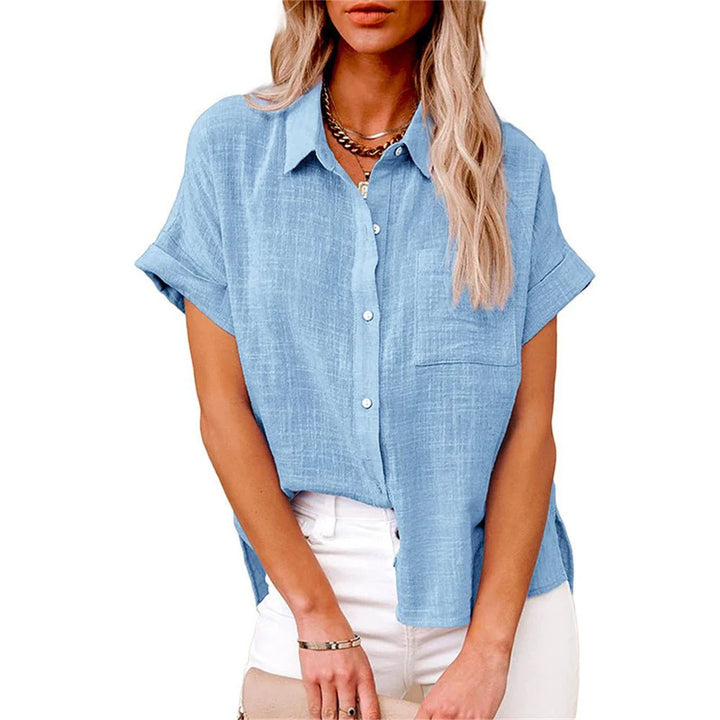 Close-up of collar and button detail on women's short-sleeve shirt