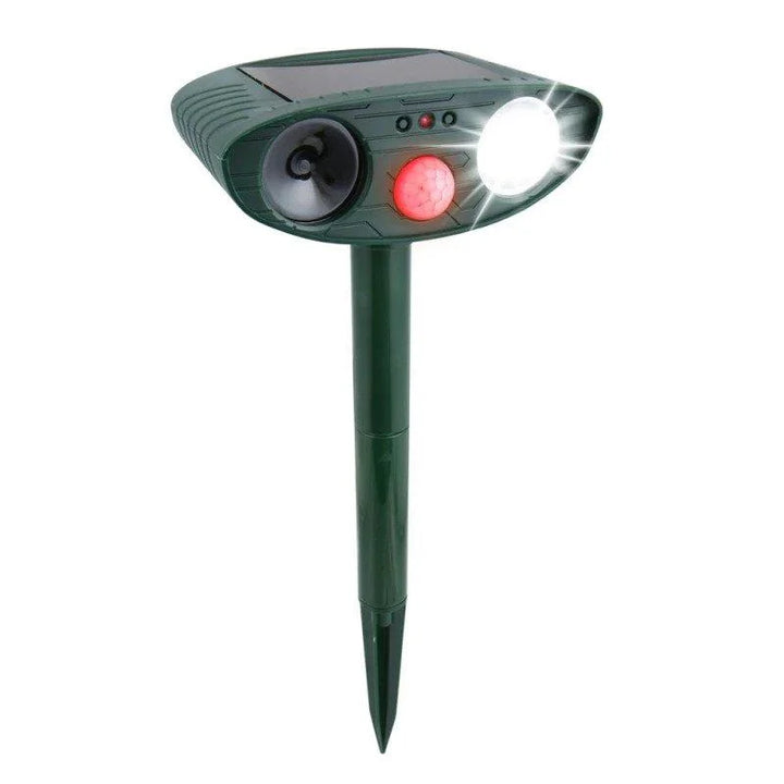 Outdoor Solar-Powered Ultrasonic Deer Repeller for Gardens with solar panel, speaker, and LED light on green stake