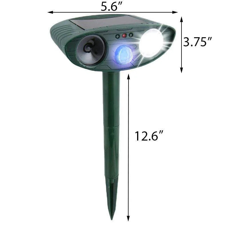 Green outdoor pest control unit with solar panel and ground stake for garden installation