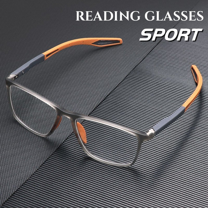 Sport Ultra-Light Anti-Blue Light Progressive Glasses with grey titanium frame and orange temple accents on textured surface