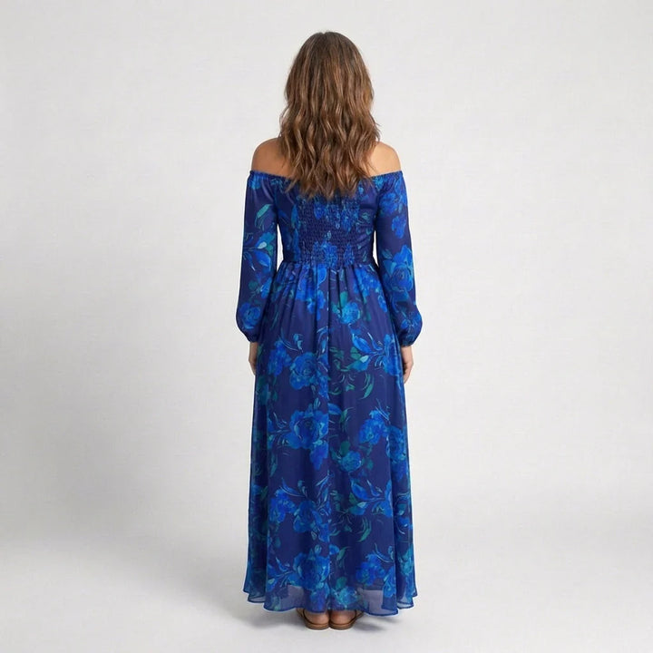 Full-length view of flowing maxi dress with off-the-shoulder neckline and long sleeves