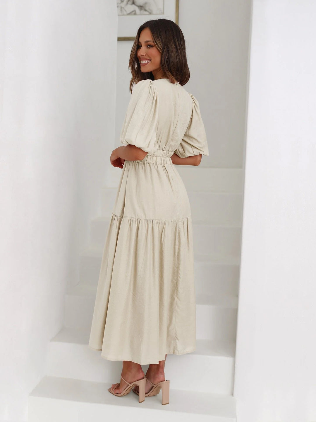 Detail shot of V-neckline and romantic puff sleeve construction