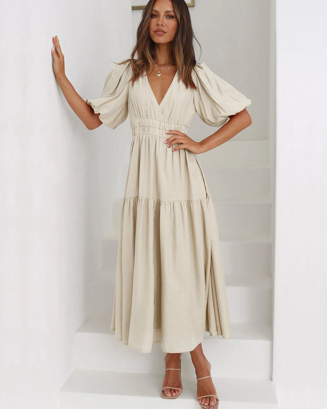 Side view showing flowing midi length skirt and wrap-style V-neckline