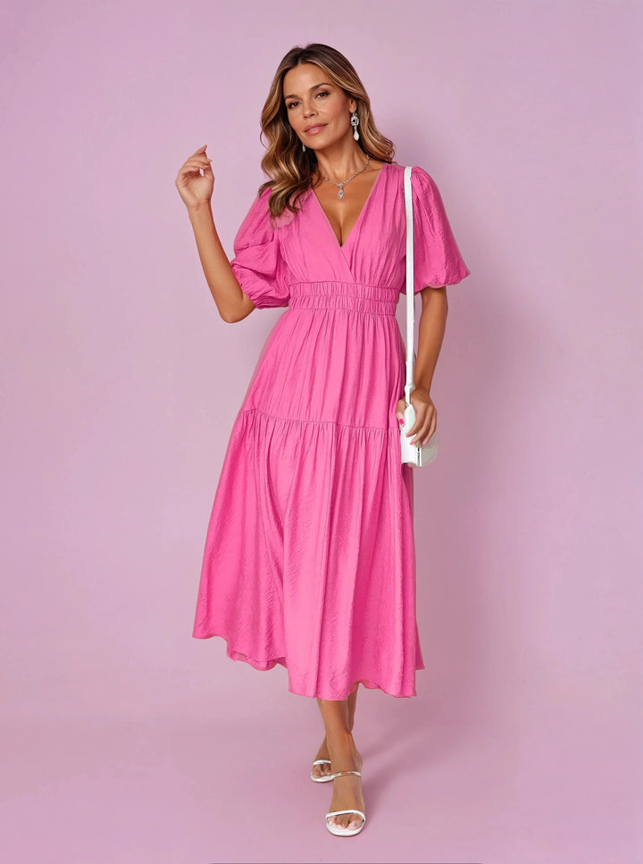 Full-length view of midi dress styled with strappy sandals and handbag