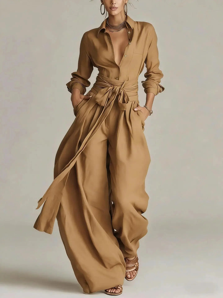 Side view of women's long-sleeve jumpsuit displaying wide-leg silhouette and natural drape