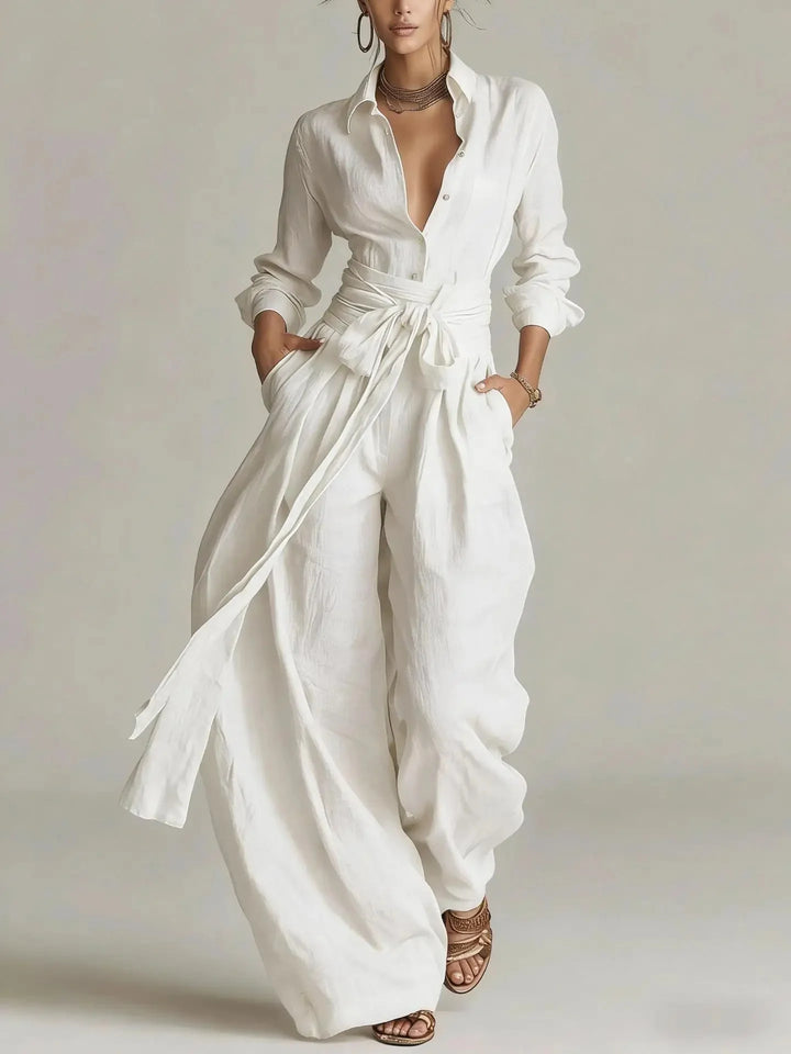Back view of belted jumpsuit highlighting relaxed fit and flowing wide-leg trousers