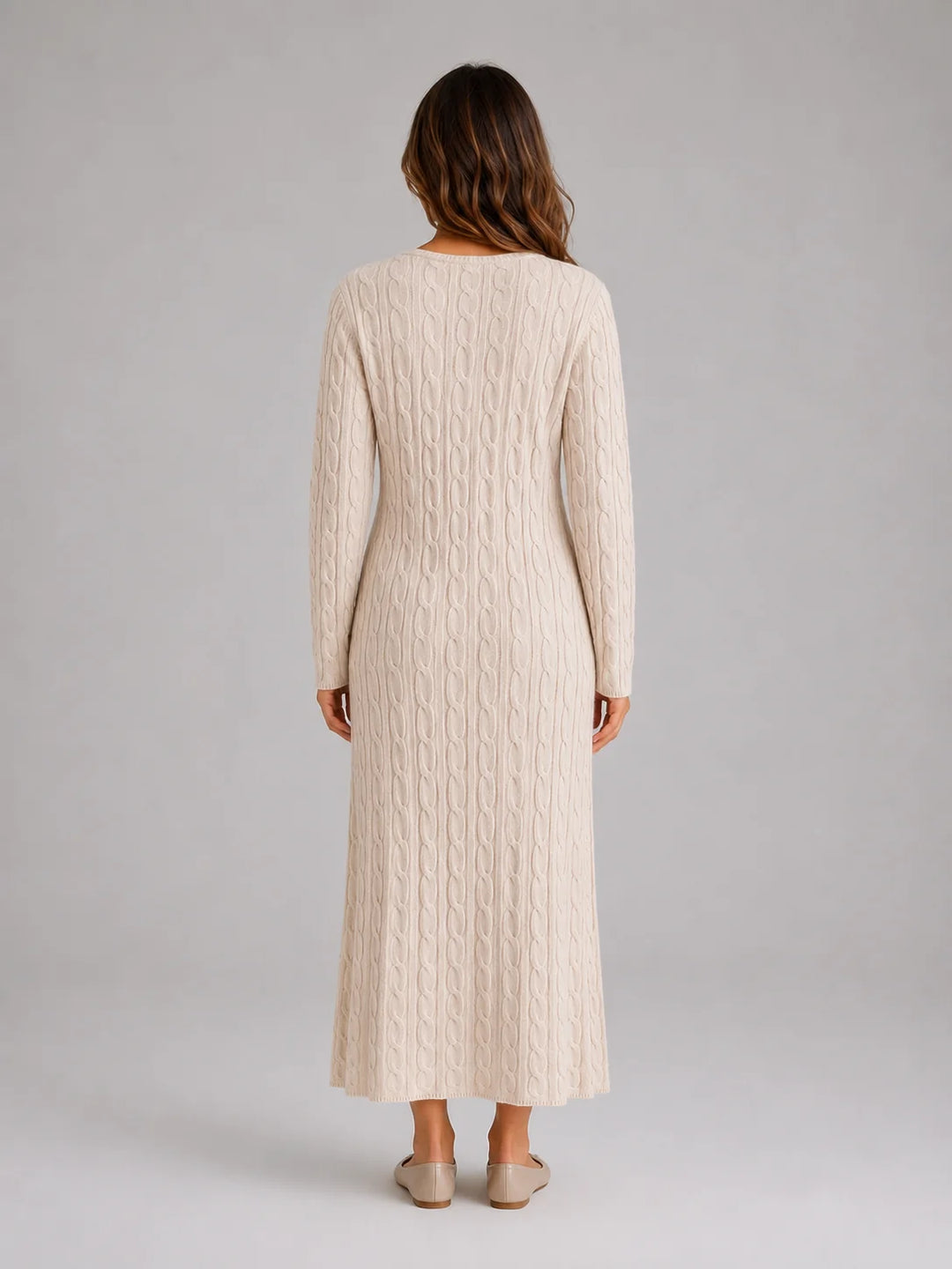 Front view of cable knit maxi dress showing all-over textured pattern and long sleeves