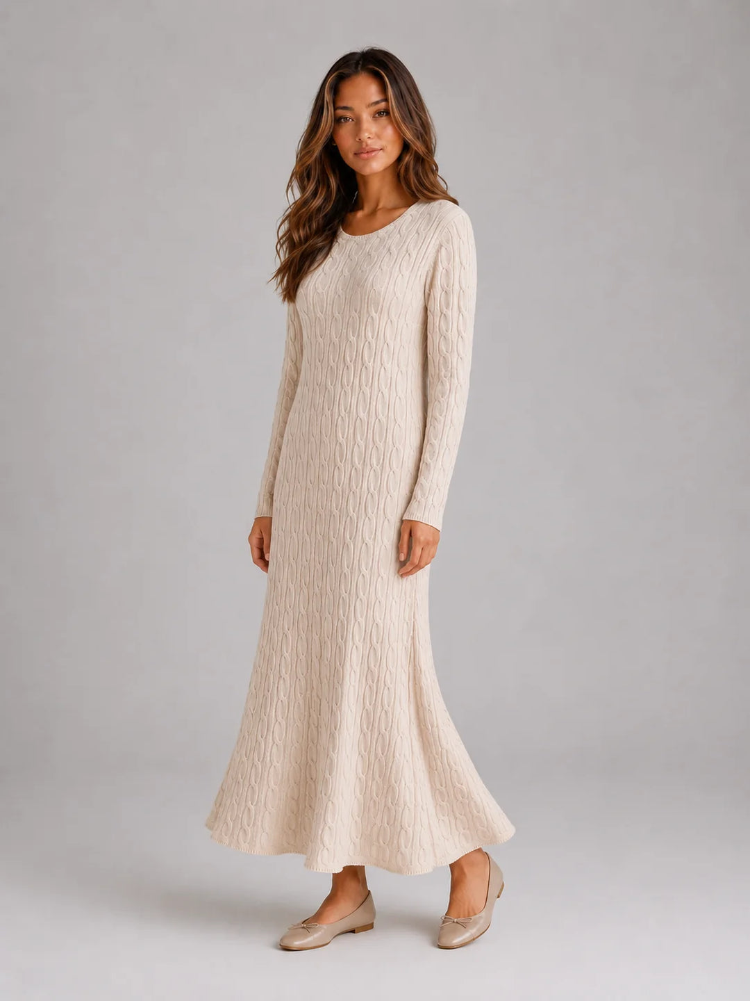Side angle of long sleeve jumper dress with flattering maxi length and ribbed detailing