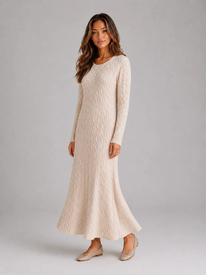 Side angle of long sleeve jumper dress with flattering maxi length and ribbed detailing