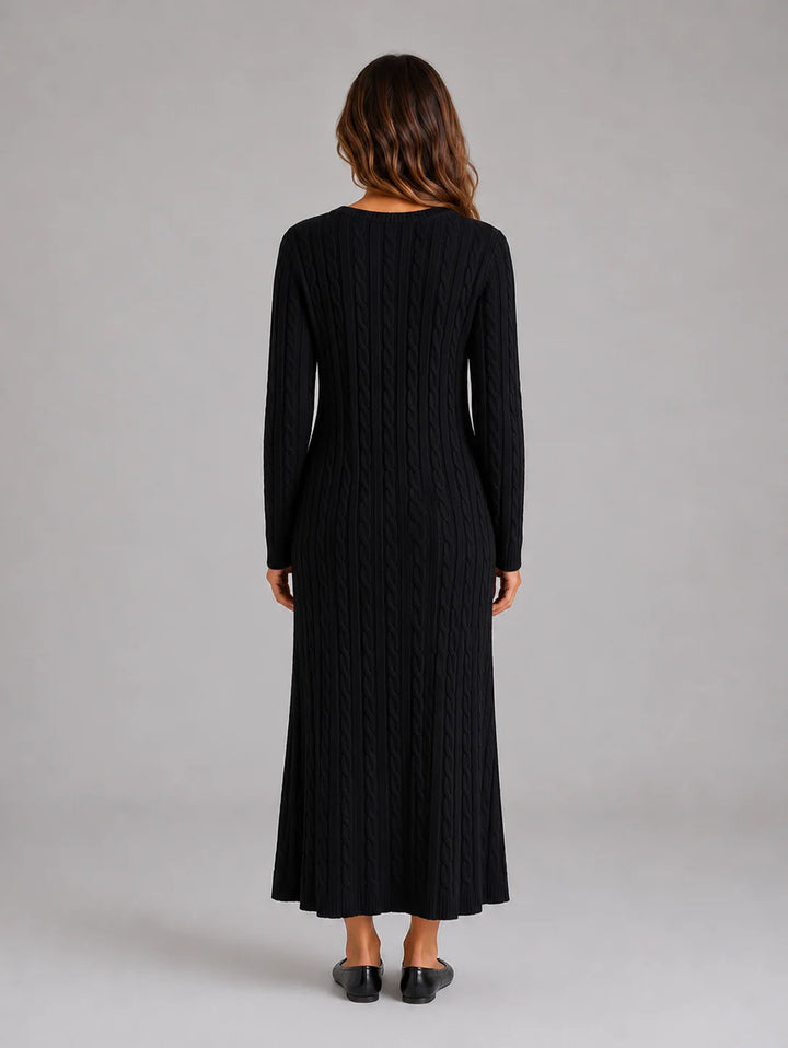 Detail shot of soft knit fabric and cable pattern on long sleeve jumper dress