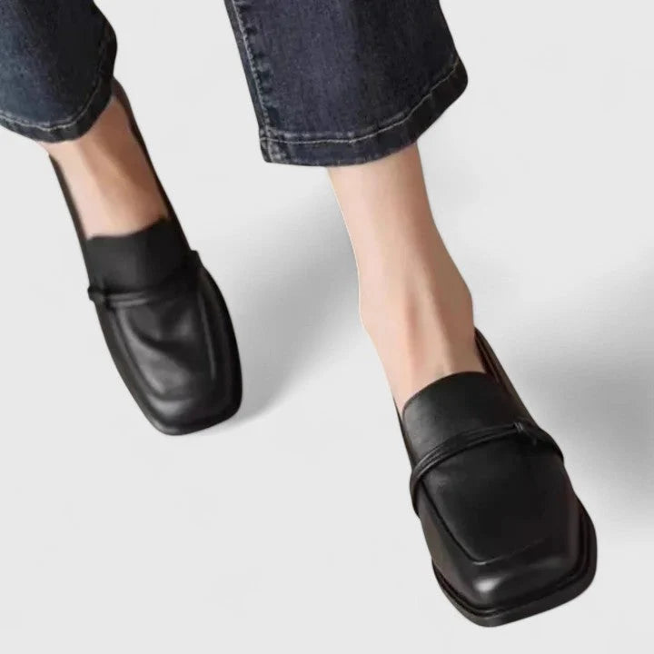 Women's Orthopedic Square Toe Classic Loafers in black with structured silhouette and slip-on design worn with cropped denim