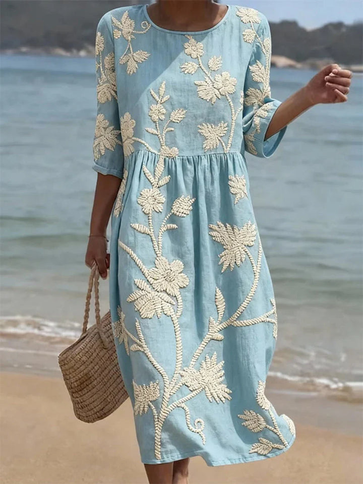 Embroidered floral midi dress in pale blue with cream floral embroidery and gathered waist