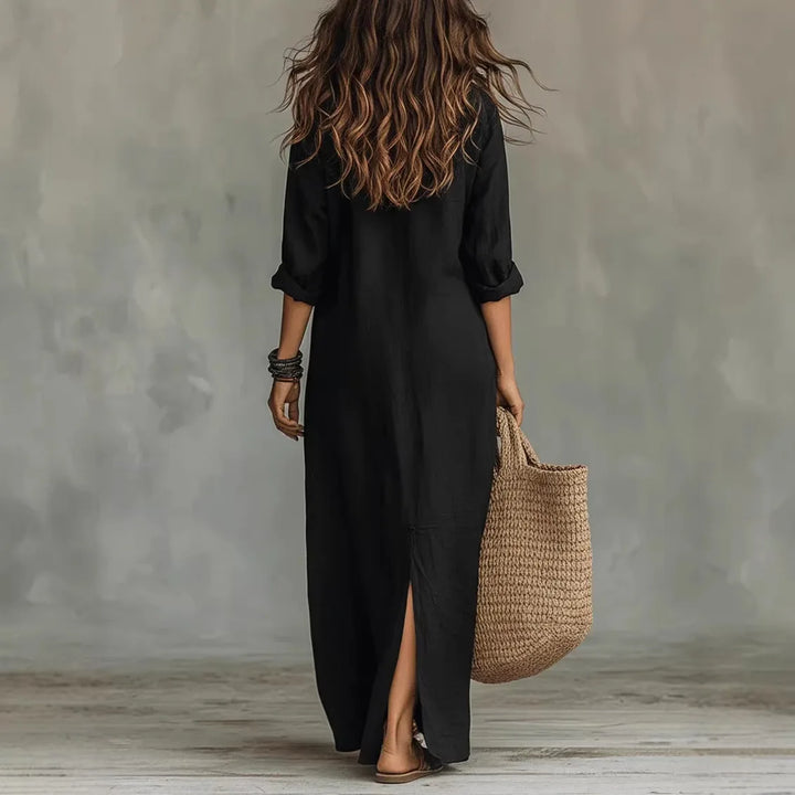Women's white linen maxi shirt dress styled with woven tote bag and sandals