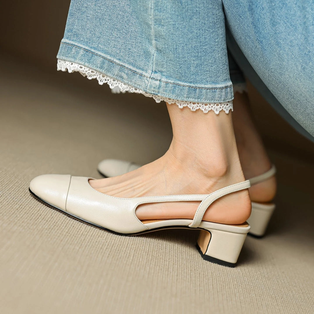 Beige leather slingback pumps with almond toe and adjustable heel strap for secure fit