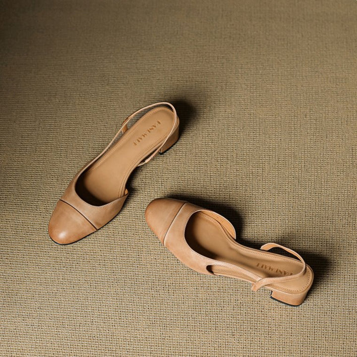 Detail of slingback strap and smooth leather finish on women's block heel pumps