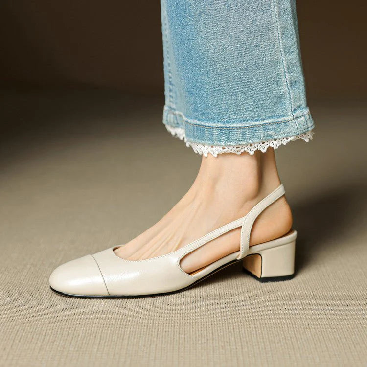 Open-back block heel pumps showing cushioned insole and structured leather upper construction