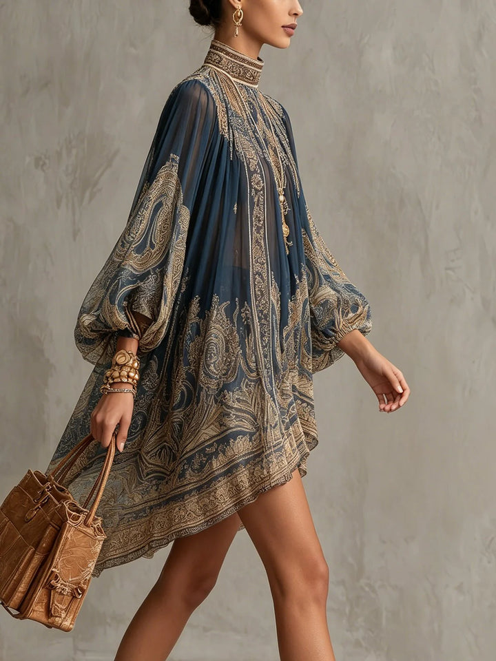 Side view of baroque print chiffon dress displaying flowing asymmetric hemline and dramatic sleeve silhouette