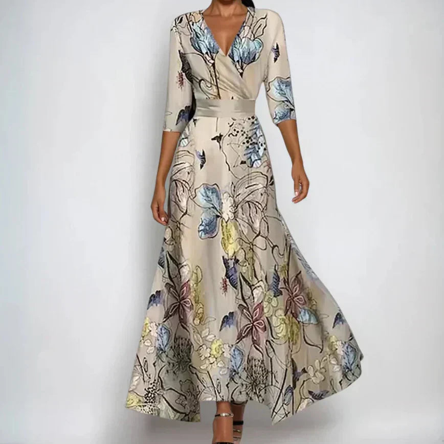 Floral wrap maxi dress with flattering design featuring botanical print and 3/4 sleeves on model