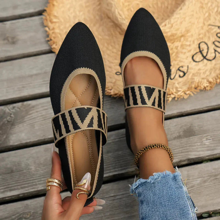 Close-up of women's Mary Jane flats showing rounded toe and textured upper