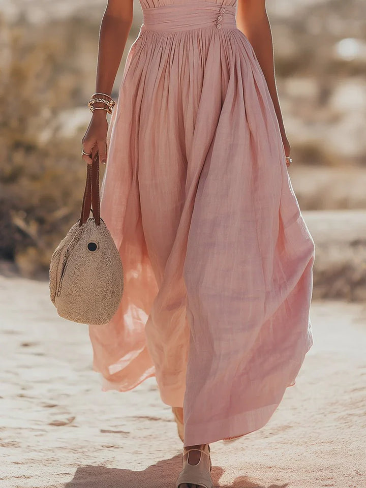 Full outfit featuring halter maxi dress with V-neckline and flowing skirt for beach holidays