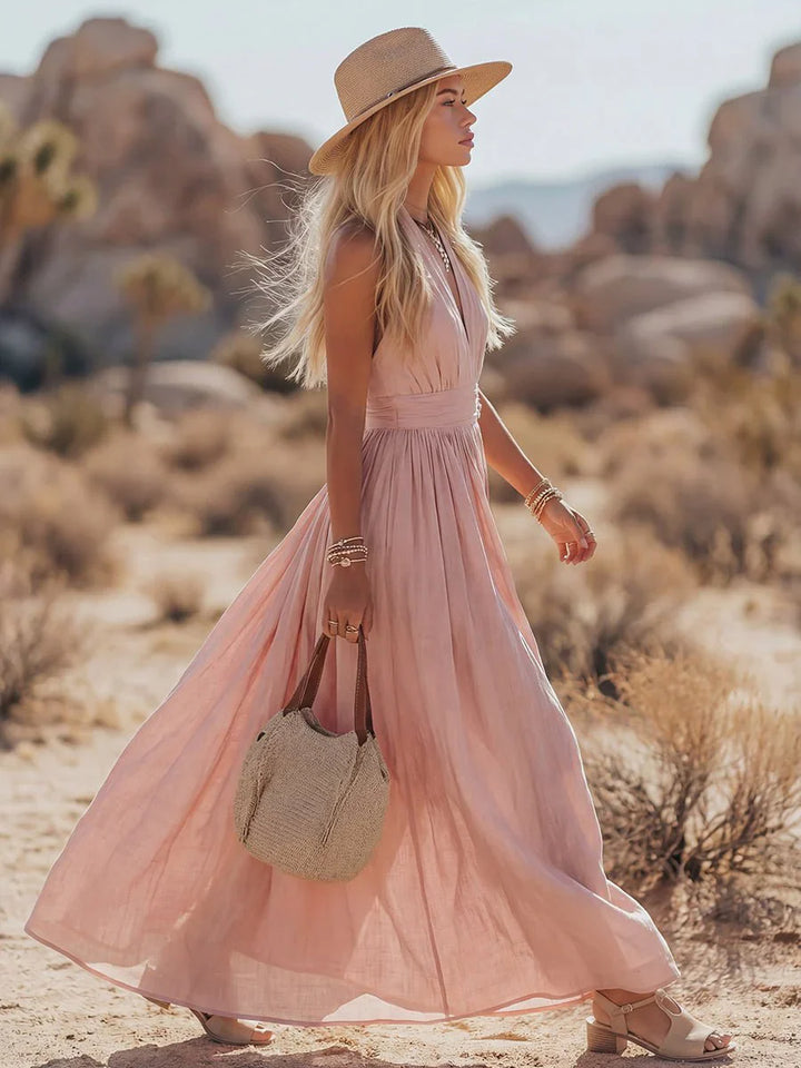 Side angle of halter maxi dress showing V-neckline and relaxed flowing skirt for warm-weather occasions