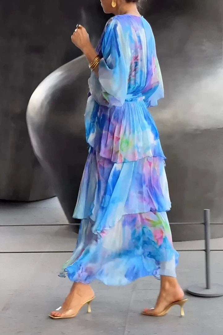Close-up view of wrap-style bodice and self-tie waist belt on tie-dye maxi dress