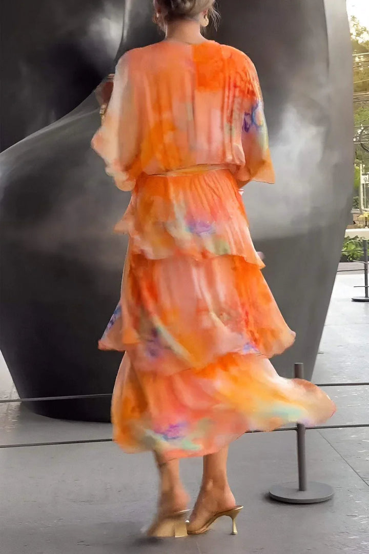 Detail shot of V-neckline and wrap bodice on watercolour tie-dye maxi dress