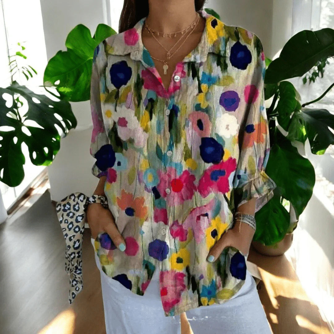 Women's floral blouse with V-neckline and button-through front in casual setting