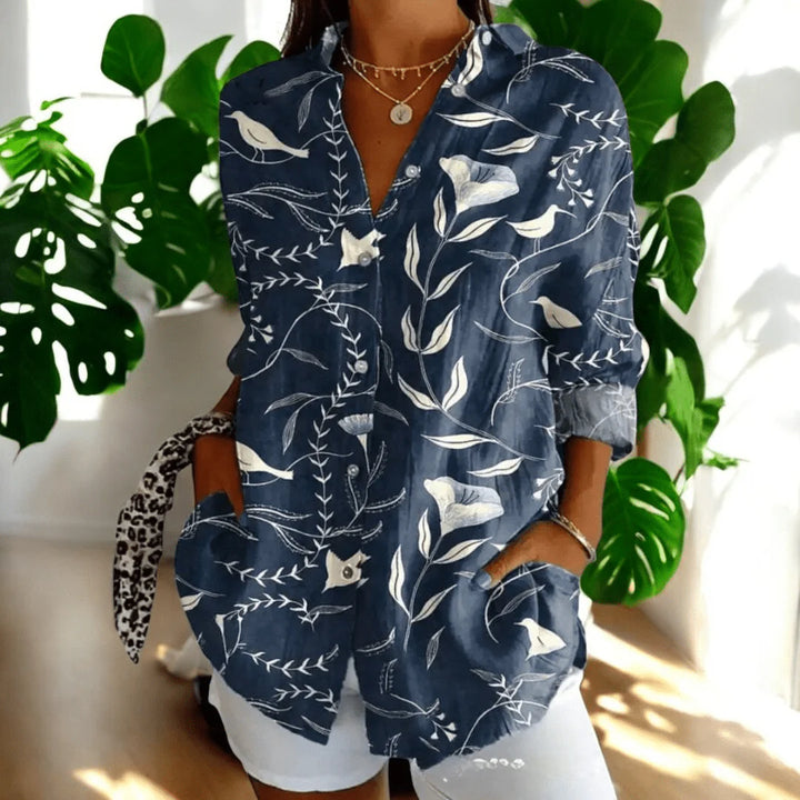 Close-up of button-through front on women's floral print blouse with hibiscus design