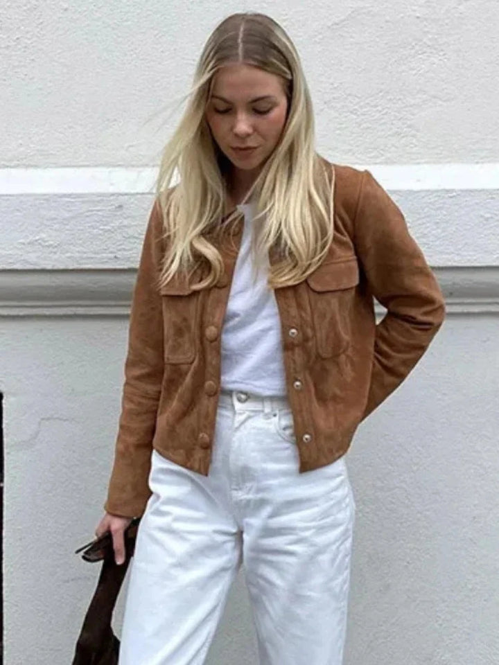 Back view of women's suede shirt jacket showing cropped hem and relaxed fit