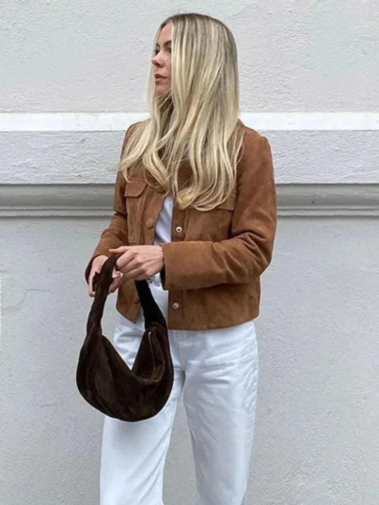Full-length view of suede shirt jacket layered over casual outfit for autumn styling
