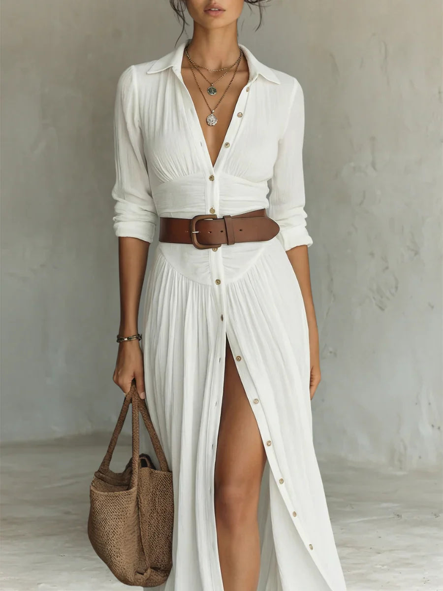 Close-up detail of pleated maxi shirt dress collar and button-front bodice with long sleeves