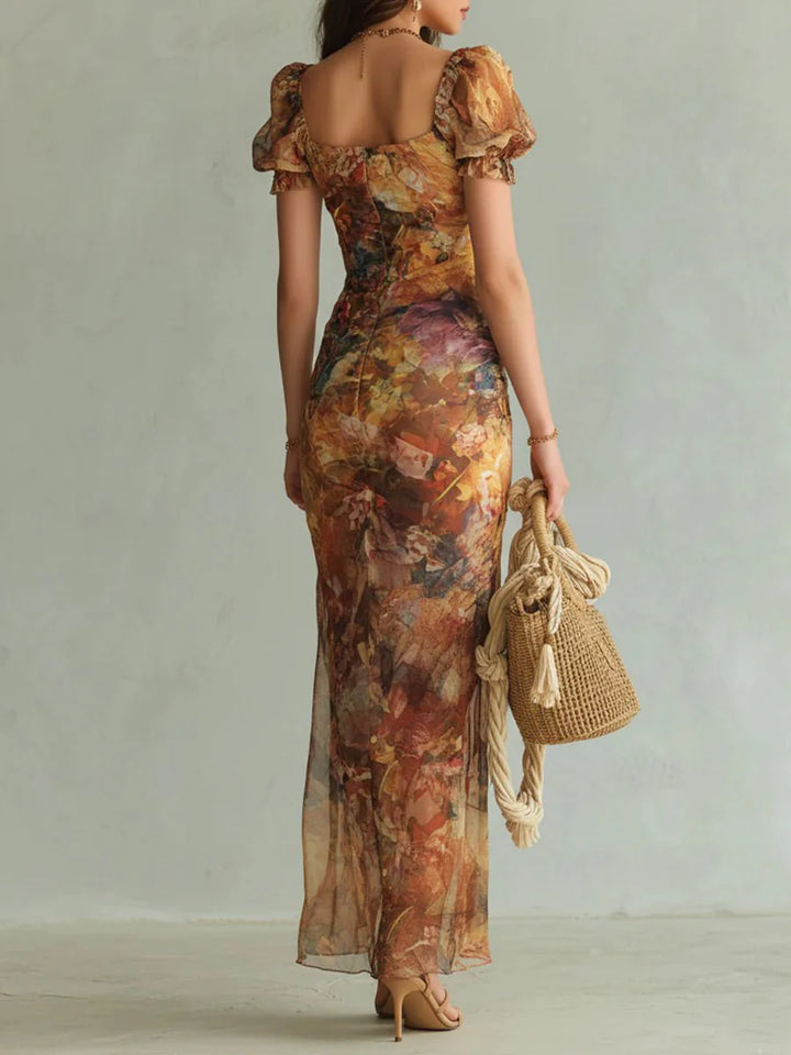 Close-up of ruffle sweetheart neckline and puff sleeves on floral print maxi dress with ruched bodice