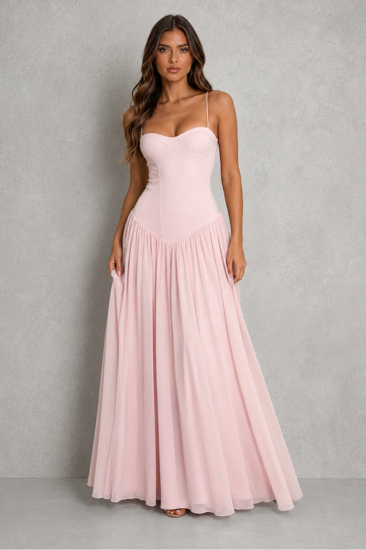 Close-up view of sculpted corset bodice with sweetheart neckline and adjustable lace-up back detail on strapless maxi dress