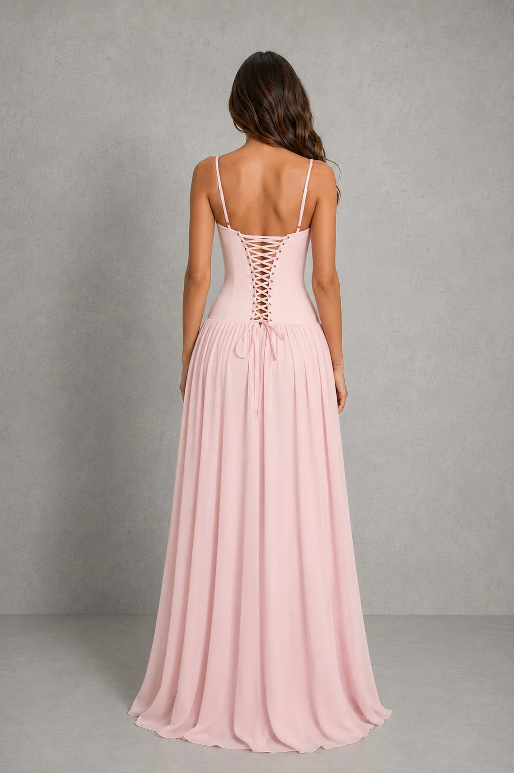 Rear view of strapless corset maxi dress featuring adjustable lace-up back closure for personalised fit and support
