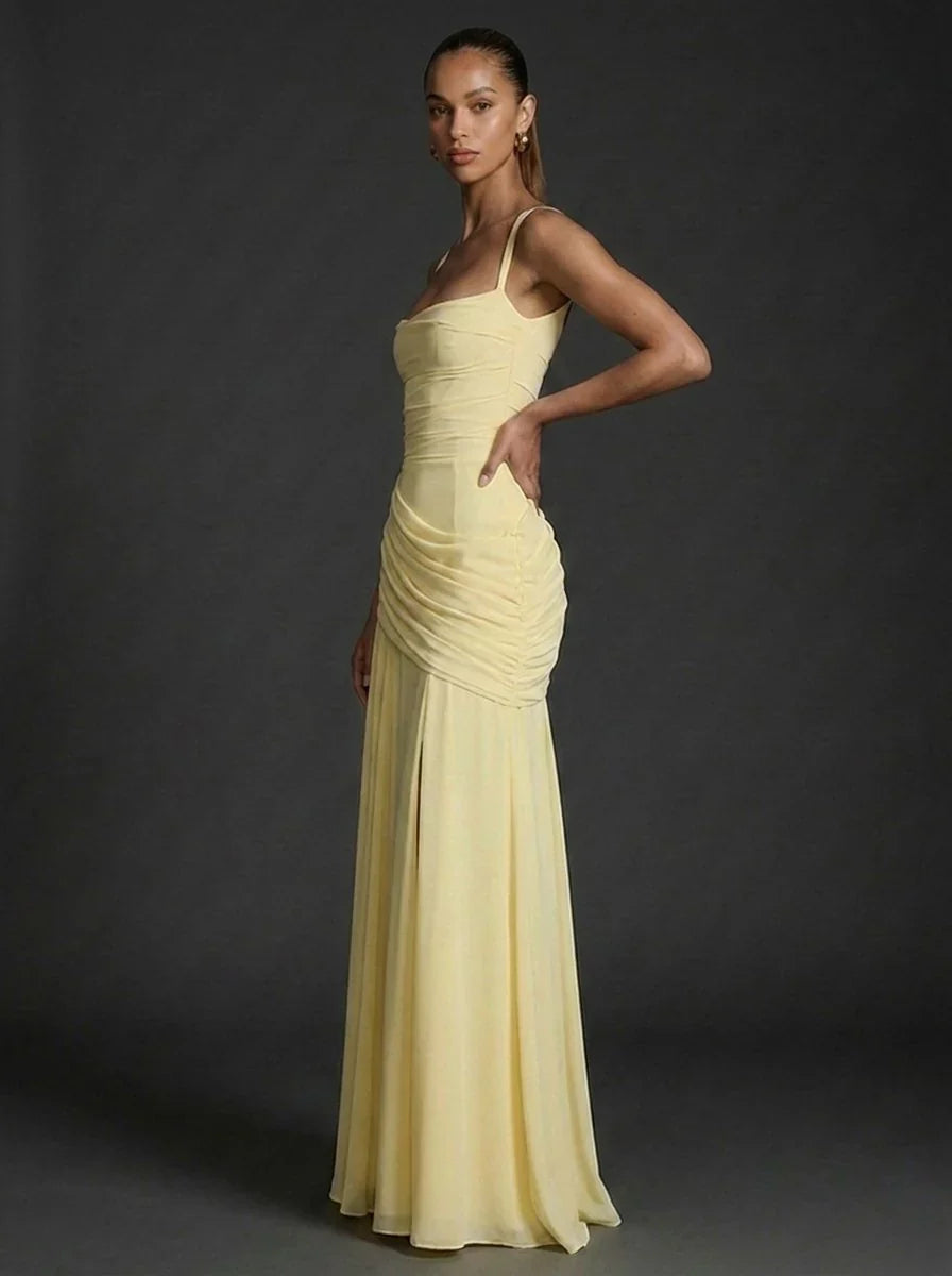 Full-length view showing floor-sweeping silhouette and draped skirt detailing on maxi dress