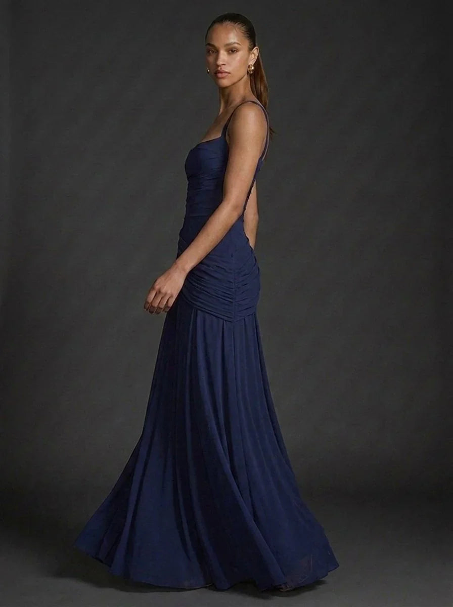 Model wearing butter yellow square-neck maxi dress for formal occasion styling