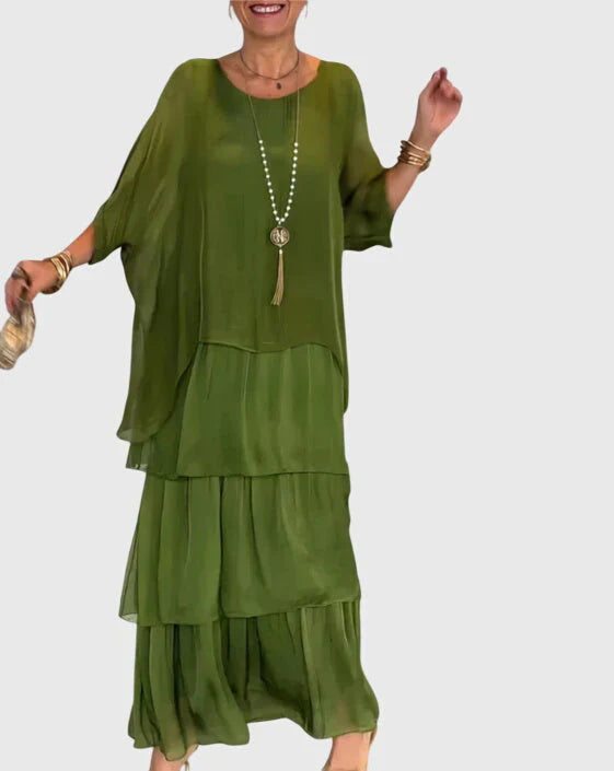 Complete look of boho layered maxi dress with dolman sleeves and flowing three-tier design