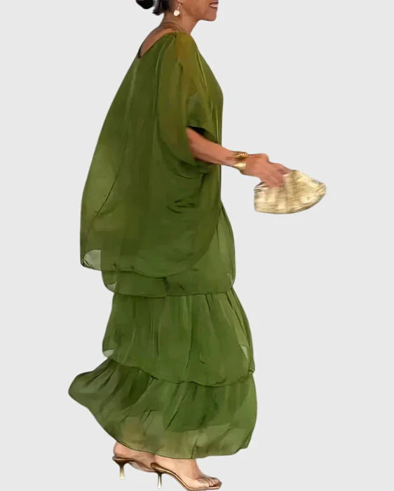 Full-length view of womens boho dress with oversized green top and vibrant tiered maxi skirt