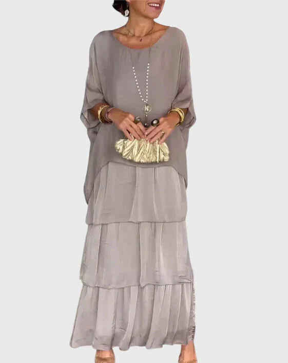 Womens tiered maxi dress styled with accessories for casual summer outings and holidays