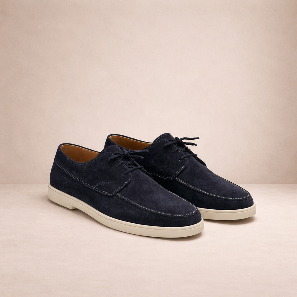 Men's lace-up moc-toe shoes in navy, pair shown at an angle