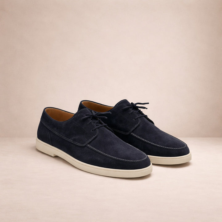 Men's lace-up moc-toe shoes in navy, pair shown at an angle