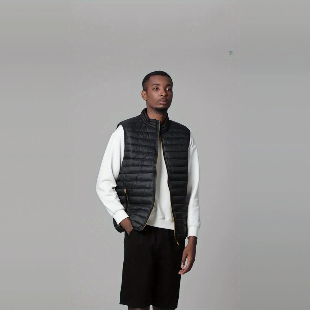 Men's lightweight quilted gilet in black, worn by a model