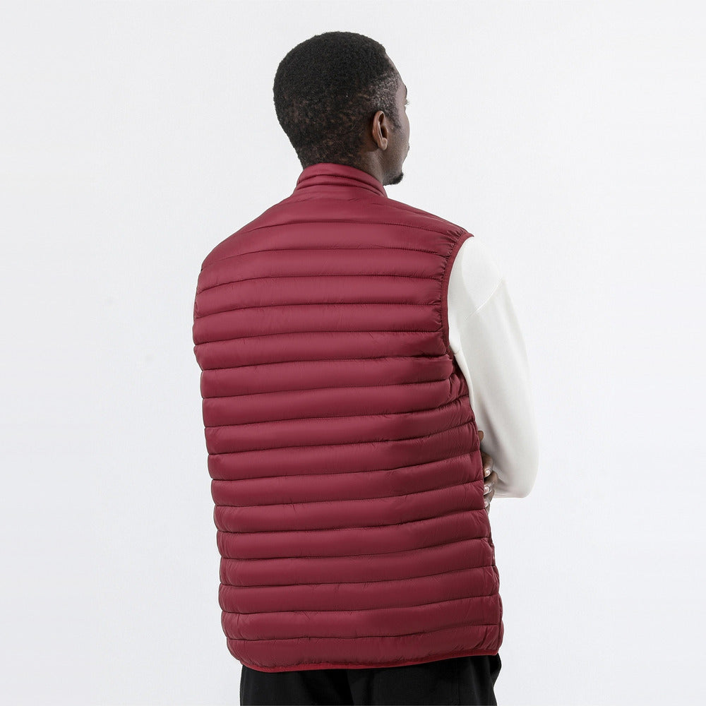 Men's lightweight quilted gilet in dark red, back view worn by a model